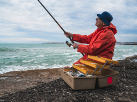 Old man fishing in the sea