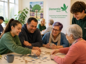 AI generated image of people doing a jigsaw puzzle together at a Dementia North community table